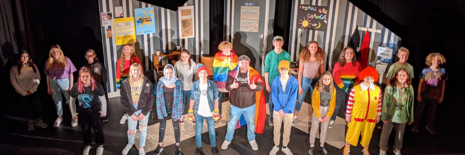 Student performers on stage in play Dungeness