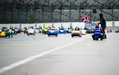 A Formula 24 racing car zooms across the screen