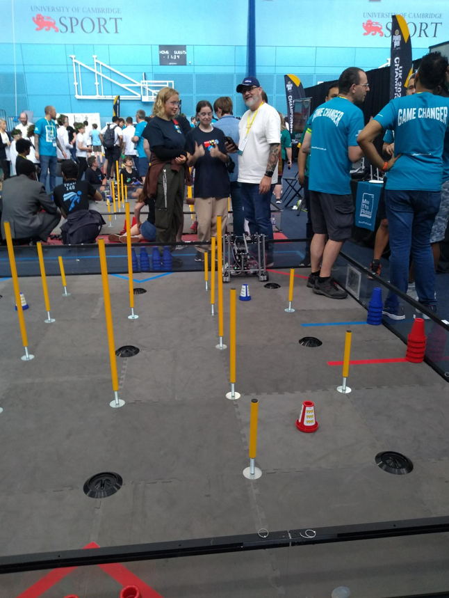 Robotics competition arena surrounded by competitiors