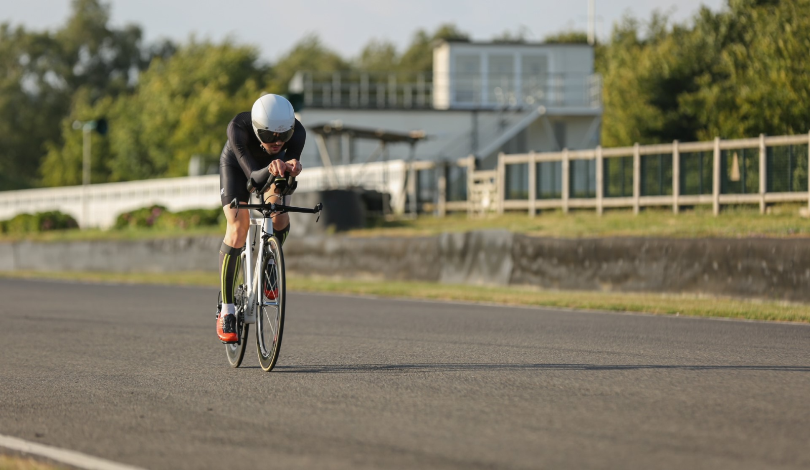 Young man cycling fast in a time trial